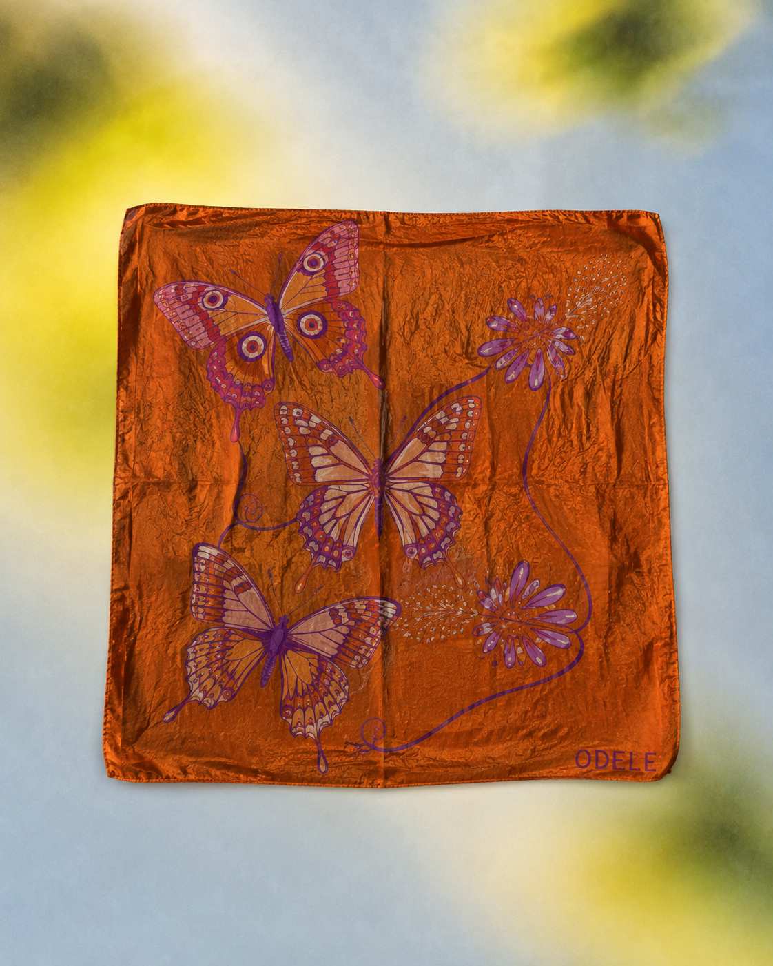 Butterfly Bandana No. 7 styled over a soft blue and yellow background