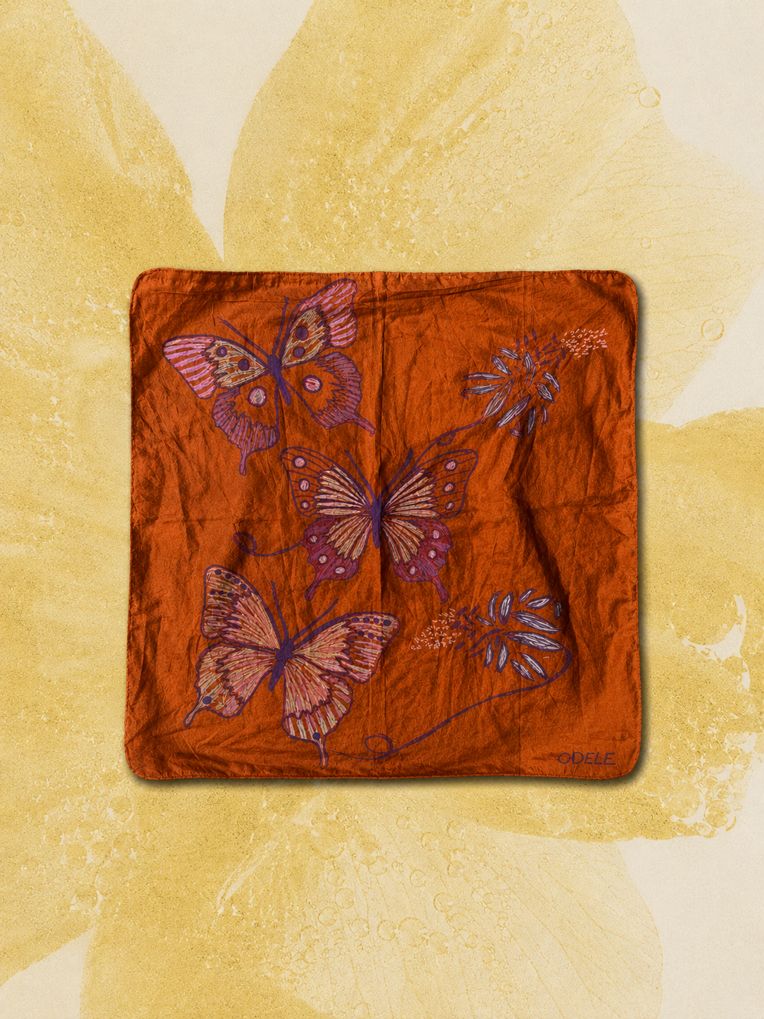 Butterfly Bandana No. 7 styled over a pale yellow floral background