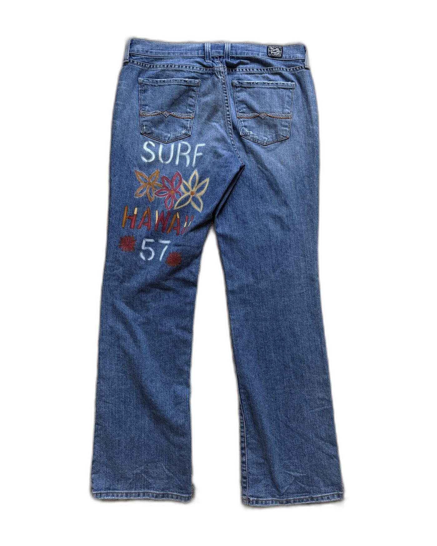 Back view of the Surf Hawaii '57 hand-painted Lucky Brand jeans on white