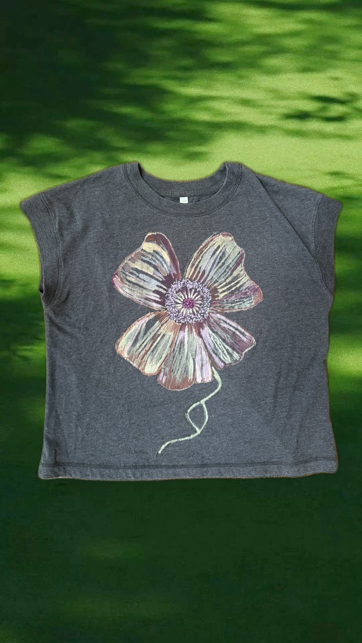 Wild Rose Relaxed Tee, hand-painted poppy, styled over dappled tree-shadow light