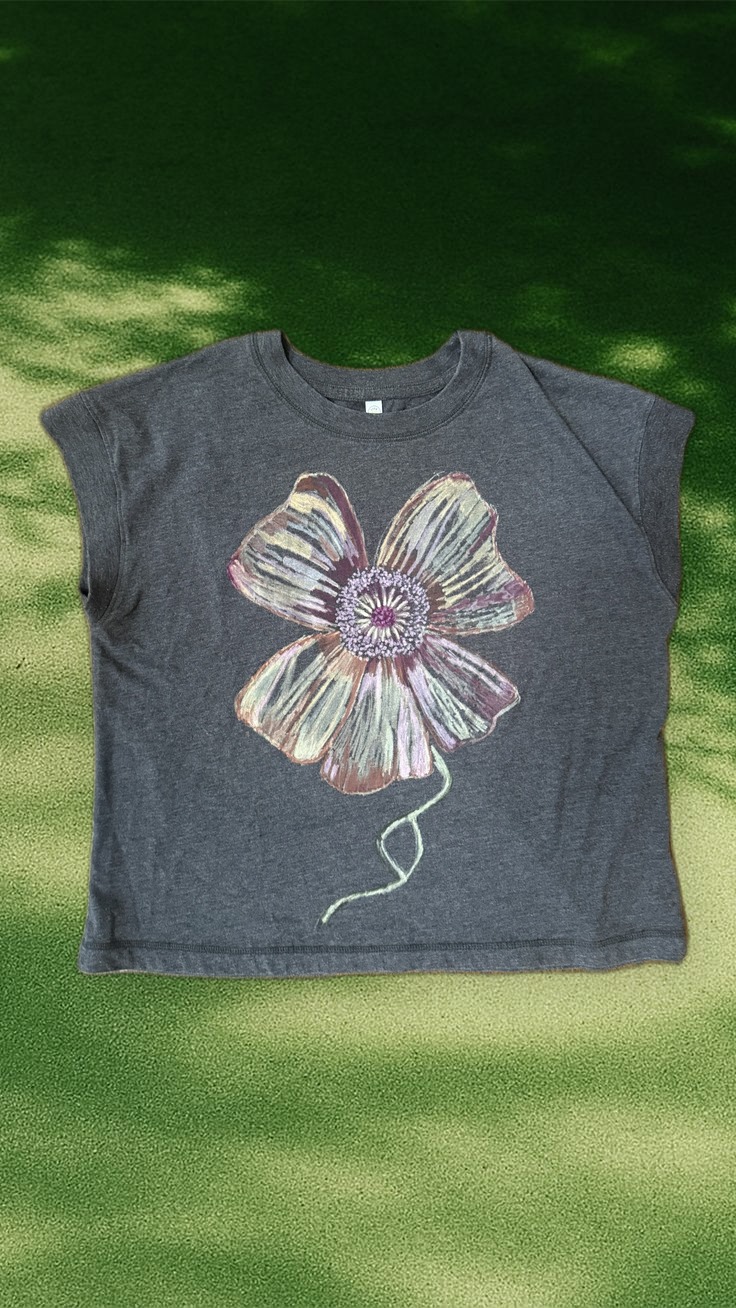 Wild Rose Relaxed Tee styled over dappled tree-shadow light, wider view